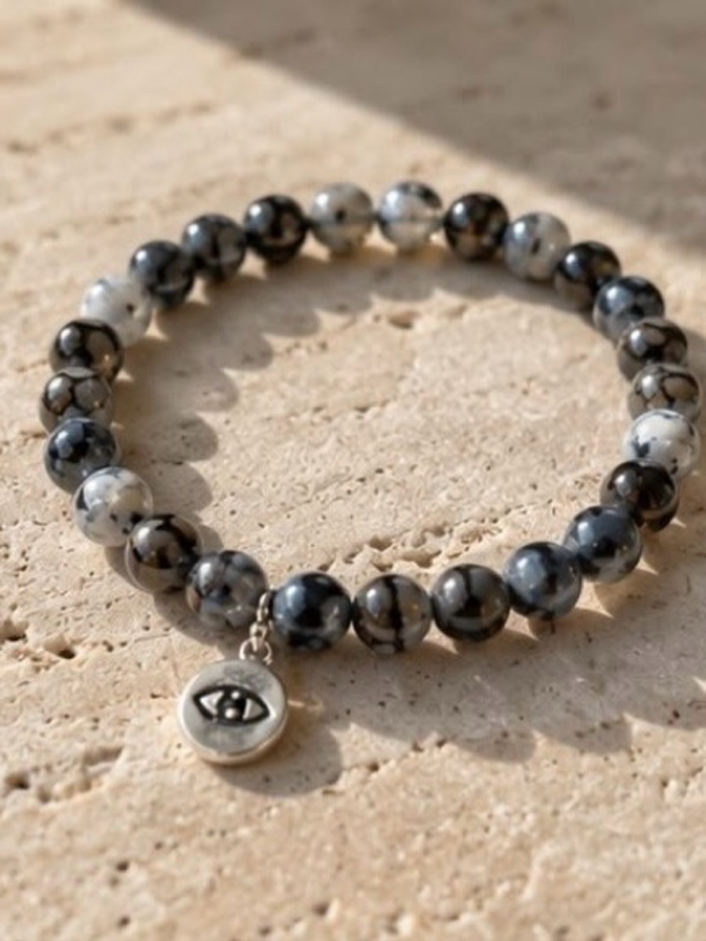 Black and White Marbled Bead Bracelet with Silver Eye Charm